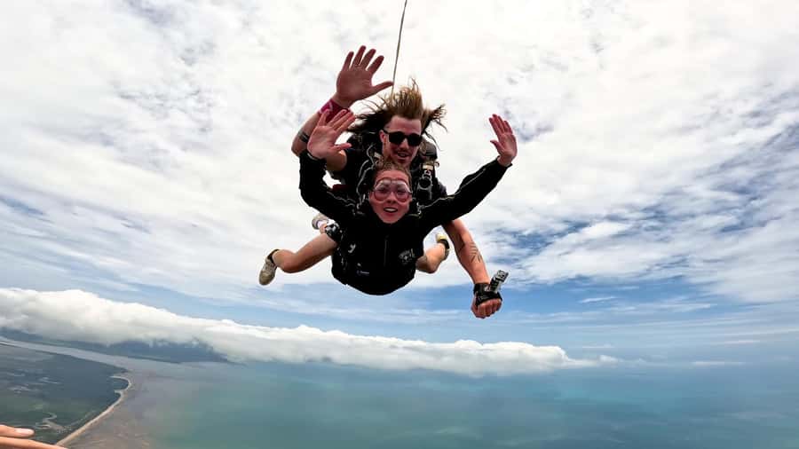 Airlie Beach: Tandem Skydiving Experience with Beach Landing - The climb toward 15,000 feet