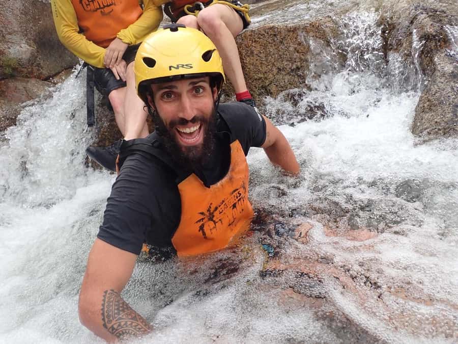 Cairns: Behana Gorge Rainforest Canyoning Tour - Rock jumps, natural slides, and water caves
