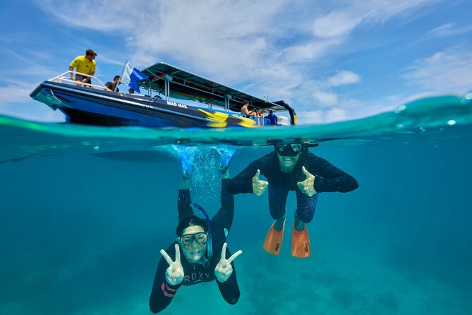 Cairns Half Day Tour a Great Barrier Reef Snorkeling Experience - Leaving Marlin Marina on a fast reef boat