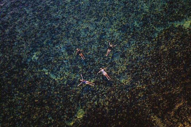 Cape Range National Park Full-Day Trekking Adventure - A swim at a secluded Ningaloo lagoon beach
