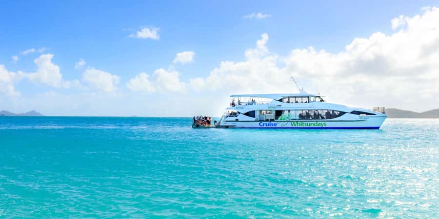 From Airlie: Whitsundays and Whitehaven Half-Day Cruise - Daydream Island and Hamilton Island stops