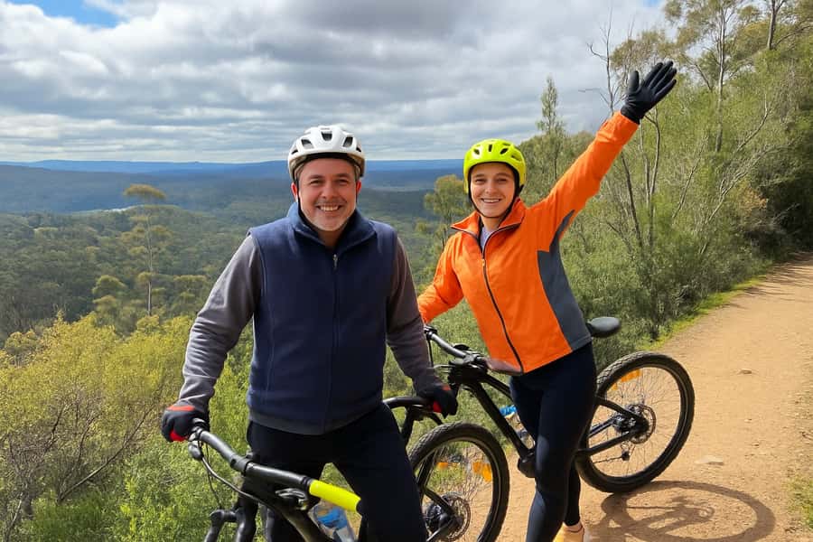From Hobart: Mt Wellington Summit & Rainforest Bike Tour - A warm change into eucalyptus forest