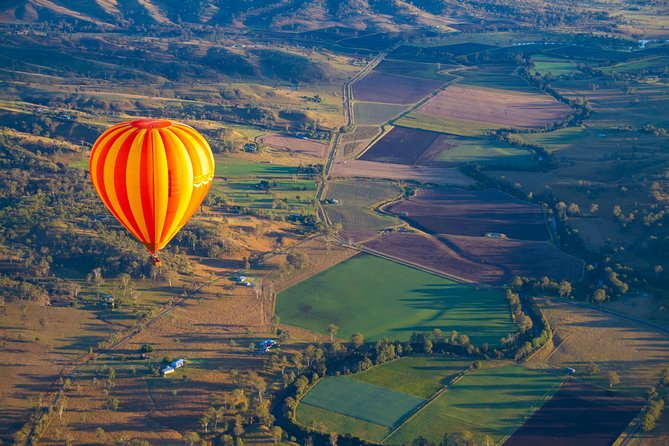 Gold Coast Hot Air Balloon + Winery Breakfast + Return Transfers - Landing and helping pack the balloon
