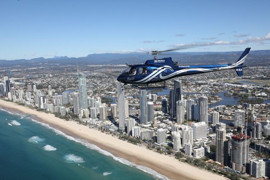 Gold Coast: Sea World and Broadwater Scenic Helicopter Tour - Crossing the coast toward Q1 and Surfers Paradise