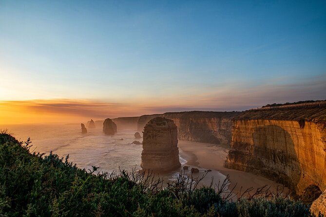 Great Ocean Road 12 Apostles & Rainforest Walk with Morning Tea - Anglesea and the Memorial Arch explain the road
