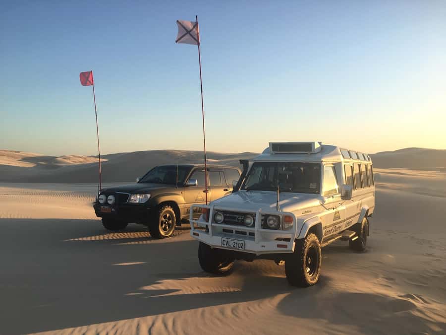 Port Stephens: Unlimited Sandboarding with 4WD Dune Transfer - A shaded base for riders and spectators