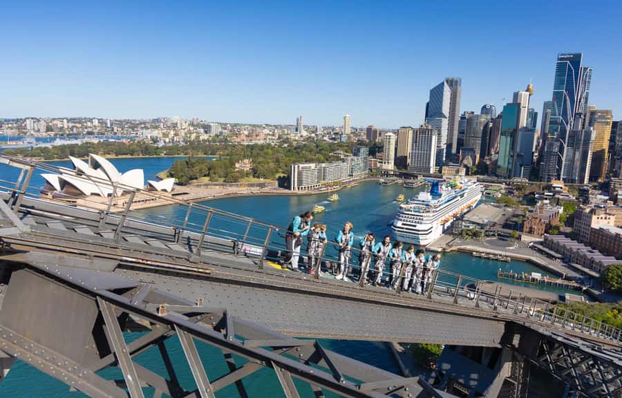 Sydney: Guided Daytime Summit Climb of Sydney Harbour Bridge - Walking the upper arch toward the summit