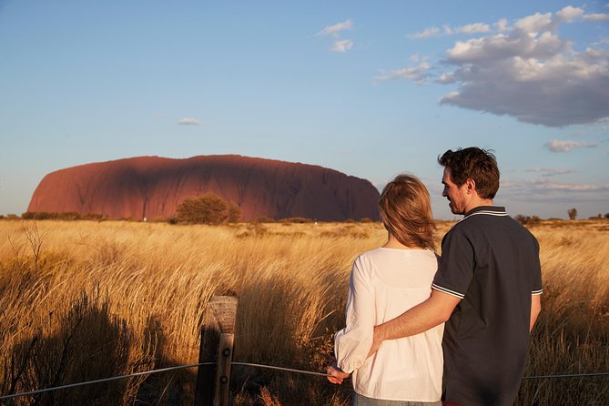 Uluru (Ayers Rock) Sunset + Outback Barbecue Dinner & Star Talk - Uluru at sunset, with a glass in hand